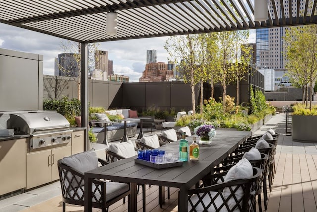 deck with a pergola and grilling area