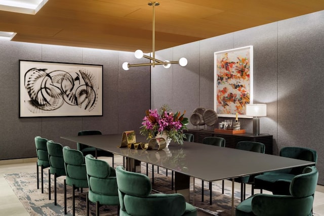 dining area with an inviting chandelier