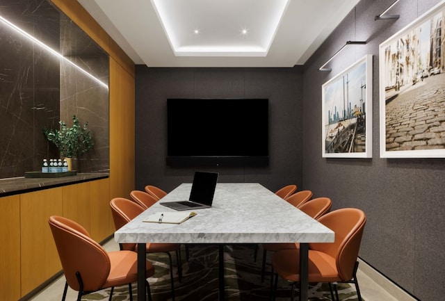 dining room with a tray ceiling