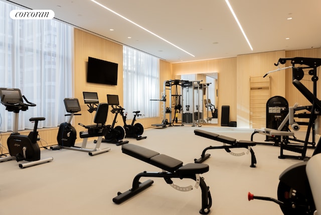 exercise room featuring wooden walls