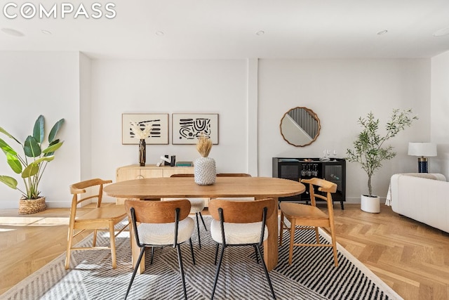 dining room featuring light parquet floors