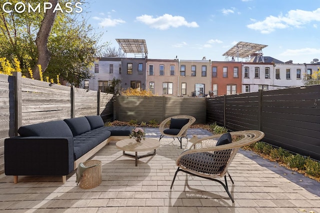 deck featuring an outdoor hangout area and a patio