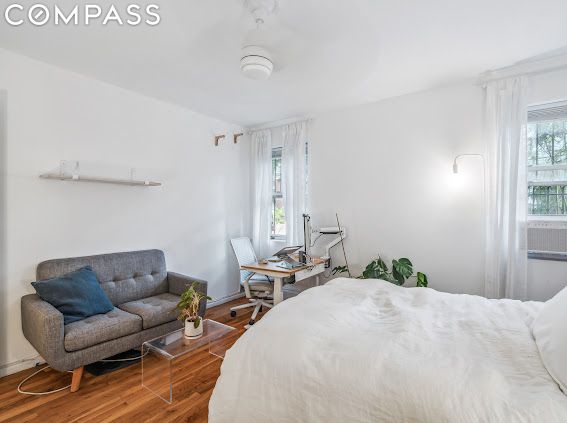 bedroom with hardwood / wood-style flooring