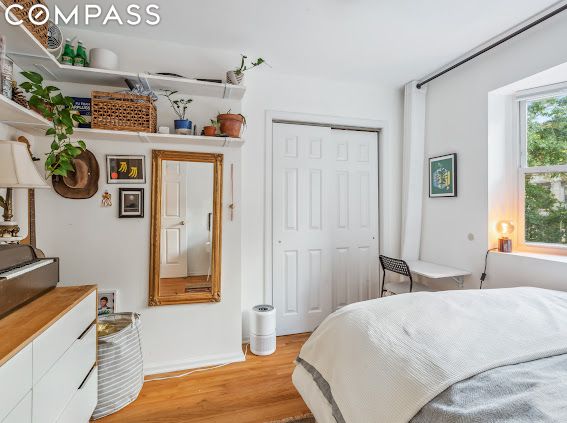 bedroom featuring light hardwood / wood-style floors and a closet