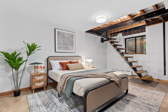 bedroom featuring a baseboard heating unit