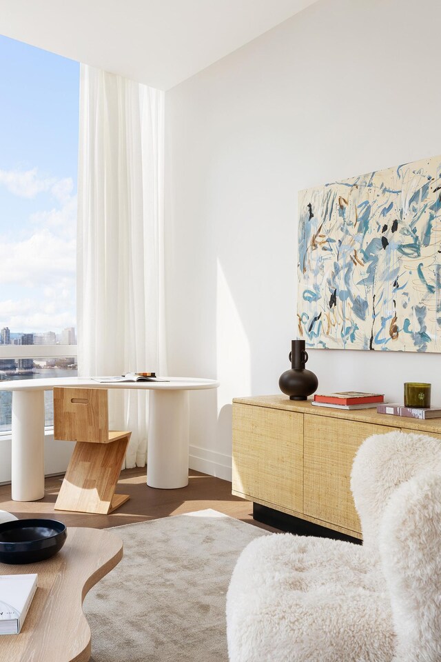 sitting room with dark wood-type flooring