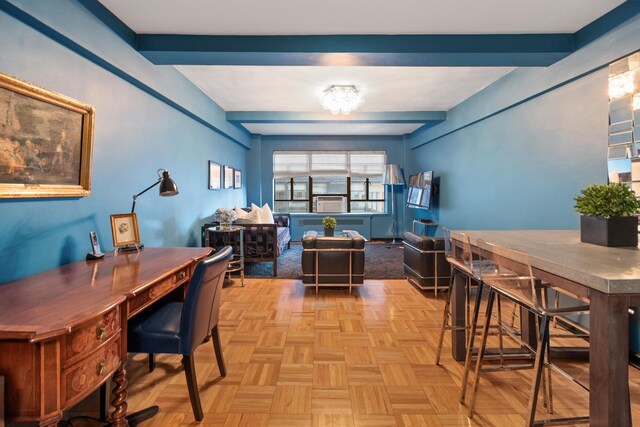 office space with beam ceiling and light parquet flooring