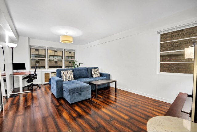 321 E 45th St Unit 8H, New York City, NY 10017 - living area with an office area, wood finished floors, and baseboards