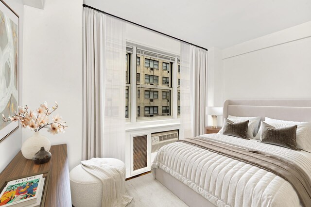 321 E 45th St Unit 8H, New York City, NY 10017 - bedroom featuring wood finished floors and an office area