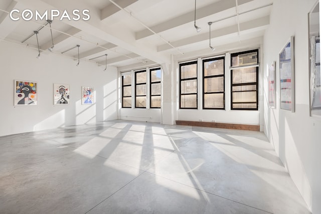 empty room featuring finished concrete flooring