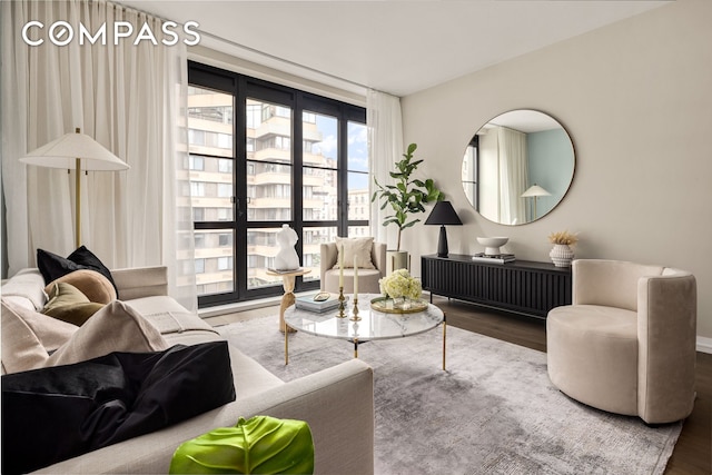 living area featuring a city view and wood finished floors