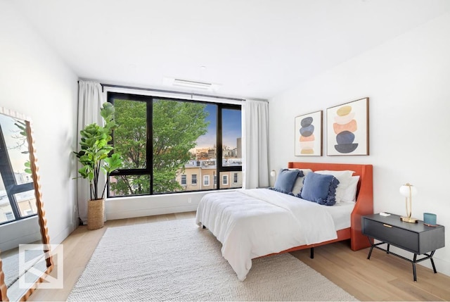 bedroom with visible vents and light wood finished floors