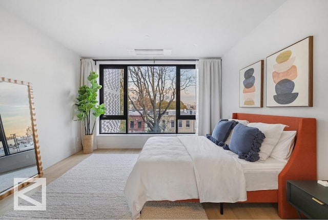 bedroom featuring light wood finished floors