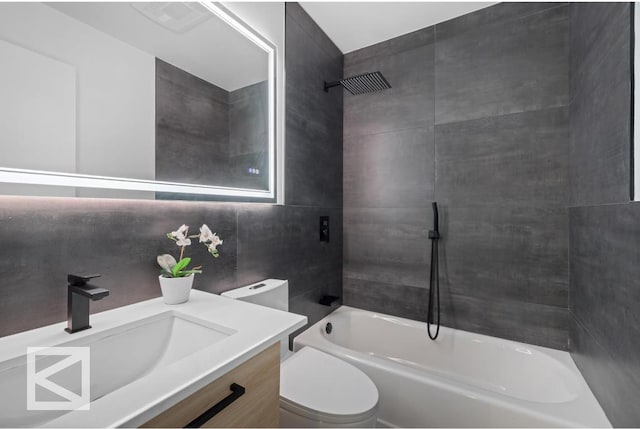 full bath featuring toilet, visible vents, tub / shower combination, and vanity