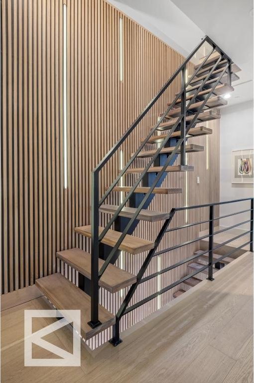 stairway with wood finished floors