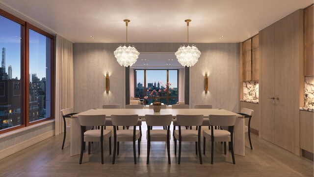 bedroom featuring access to outside, parquet flooring, and an inviting chandelier