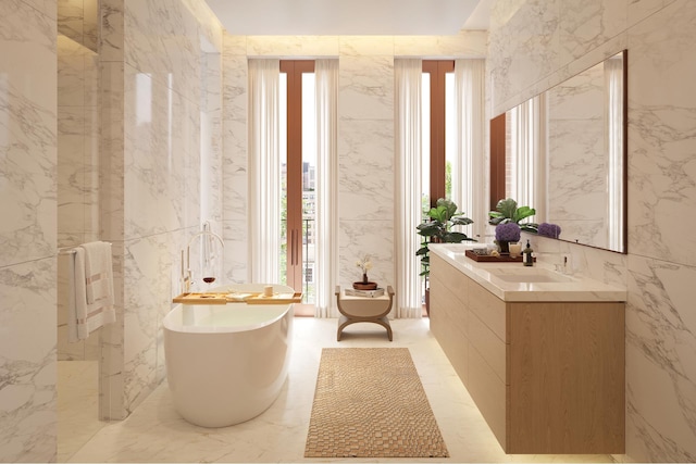 full bath featuring vanity and a freestanding bath