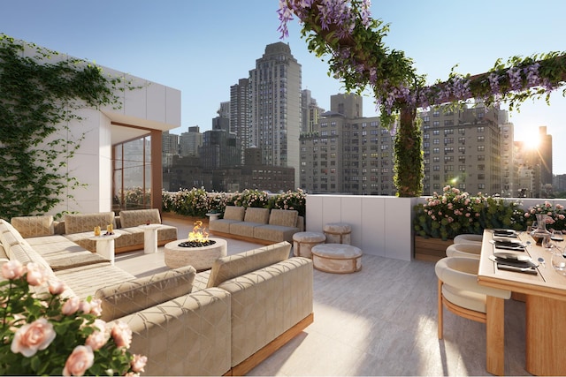 view of patio / terrace featuring an outdoor living space with a fire pit and a city view