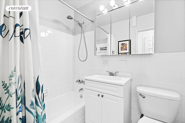 bathroom featuring toilet, vanity, shower / bath combination with curtain, and tile walls