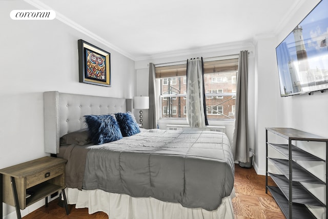 bedroom featuring baseboards, visible vents, and crown molding