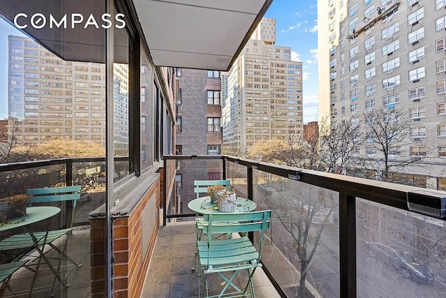 balcony featuring a city view