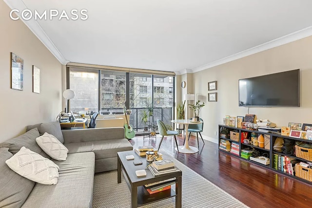 living room featuring crown molding, floor to ceiling windows, wood finished floors, and baseboards