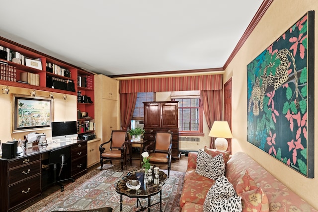 living area with radiator, crown molding, and wood finished floors