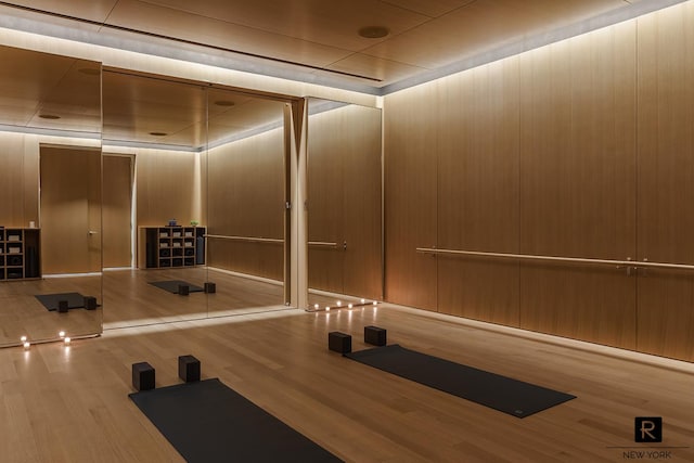 workout room with wood finished floors