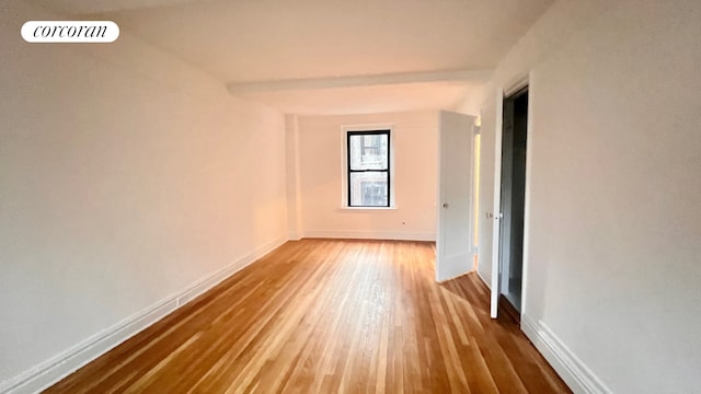 319 E 50th St Unit 5G, New York City, NY 10022 - spare room with wood finished floors and baseboards