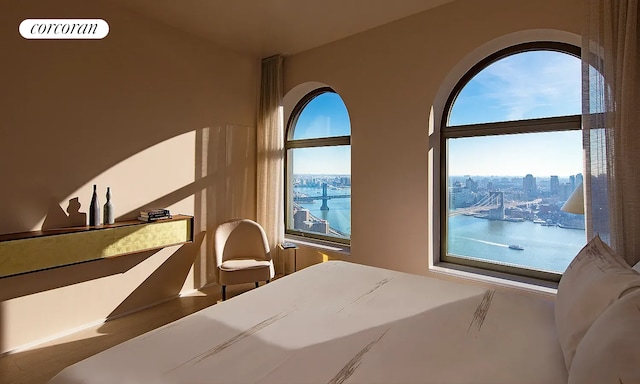 bedroom featuring a city view