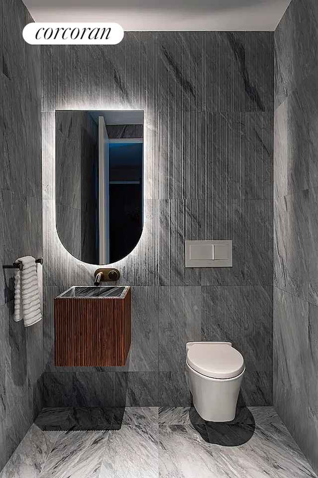 130 William St Unit 46A, New York City, NY 10038 - bathroom with marble finish floors and tile walls