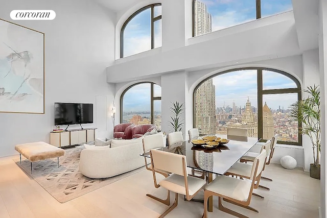 130 William St Unit 46A, New York City, NY 10038 - dining room with wood finished floors and a towering ceiling