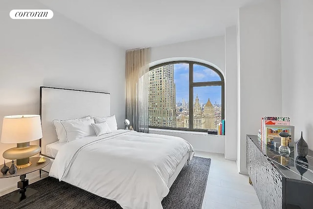 bedroom with a view of city and visible vents