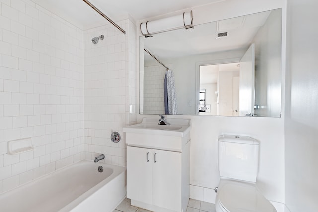 bathroom featuring vanity, visible vents, shower / bath combo, tile patterned flooring, and toilet