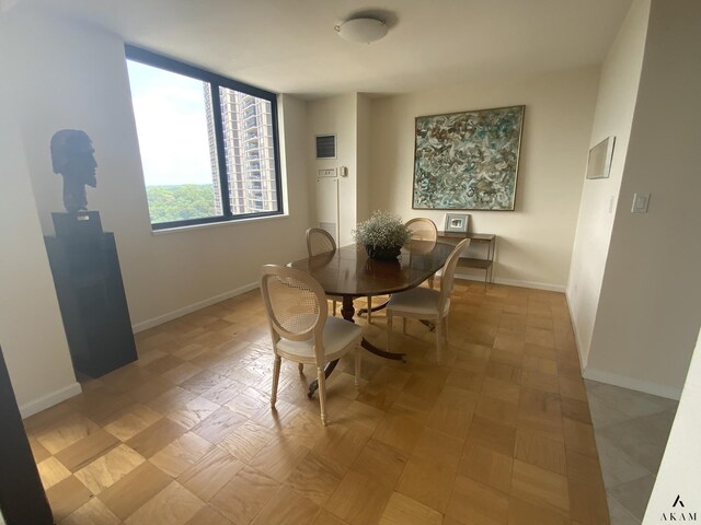 dining area with light parquet flooring