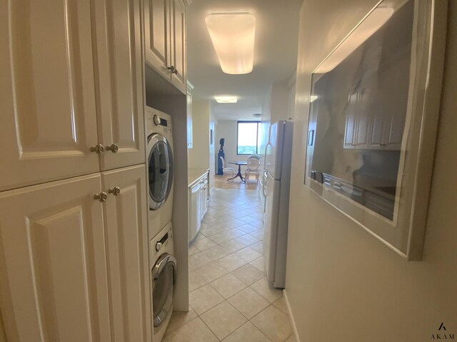 bathroom featuring toilet, vanity, tile walls, tile patterned floors, and a shower with door