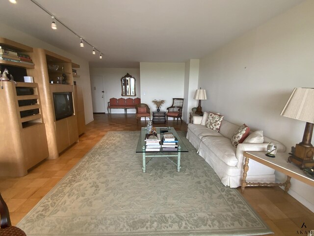 kitchen with light tile patterned floors, white cabinetry, sink, and white appliances