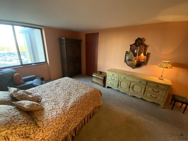 bedroom featuring light carpet