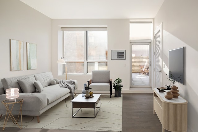 living room with dark hardwood / wood-style floors and a wealth of natural light