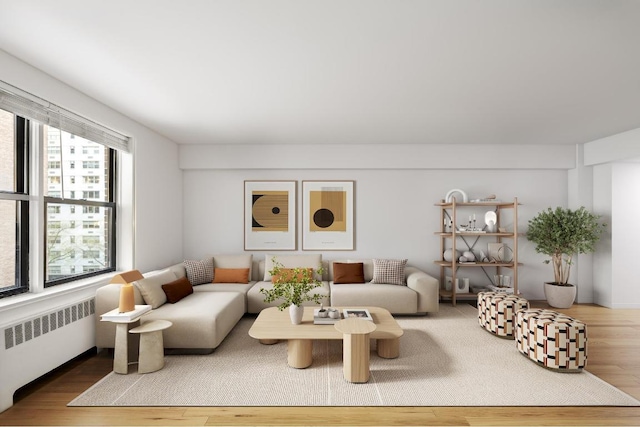 living room featuring radiator heating unit and hardwood / wood-style floors