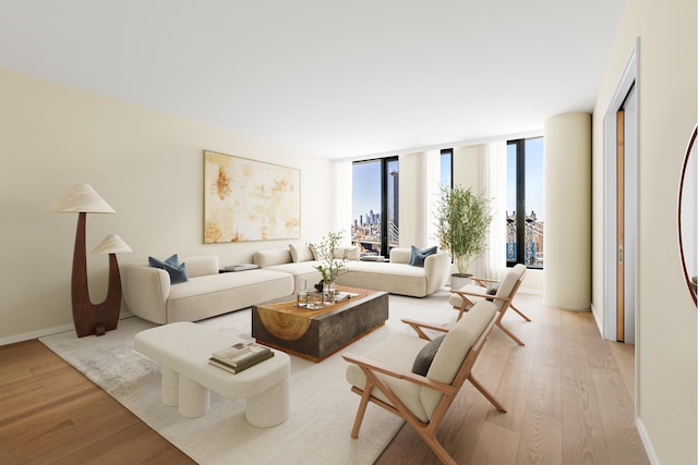 30 Front St Unit 28B, New York City, NY 11201 - living area featuring light wood-style flooring and expansive windows