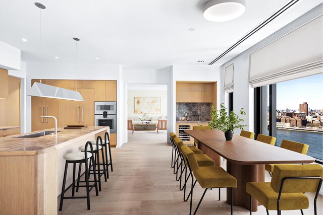 30 Front St Unit 28B, New York City, NY 11201 - dining space with wine cooler, light wood-style floors, and recessed lighting