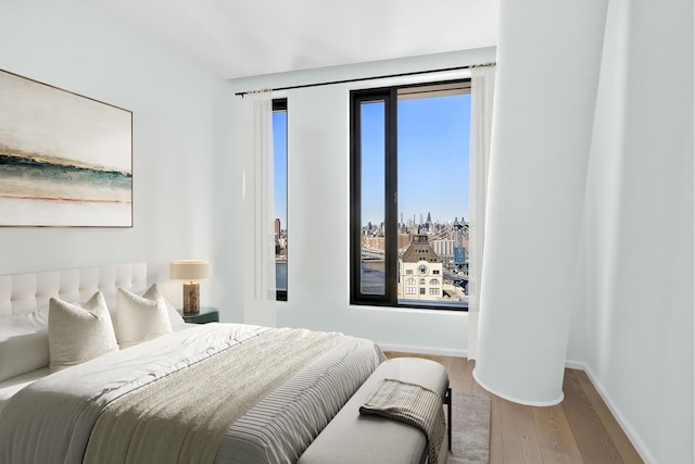 30 Front St Unit 28B, New York City, NY 11201 - bedroom with wood finished floors and baseboards