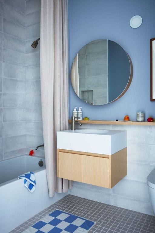 bathroom with vanity, shower / bathtub combination with curtain, and tile patterned floors