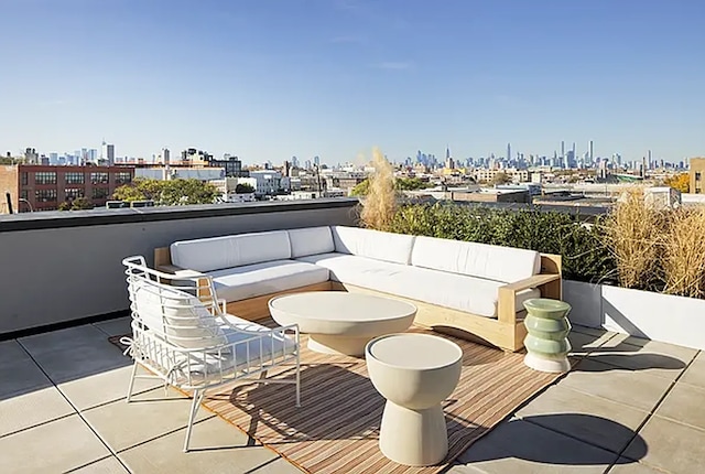 balcony featuring a view of city and an outdoor living space