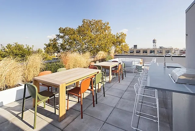 view of patio / terrace featuring outdoor dry bar and outdoor dining area