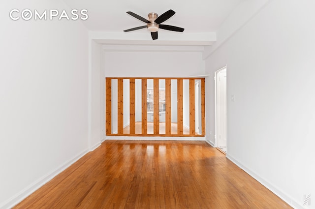 spare room featuring a ceiling fan and light wood-style flooring