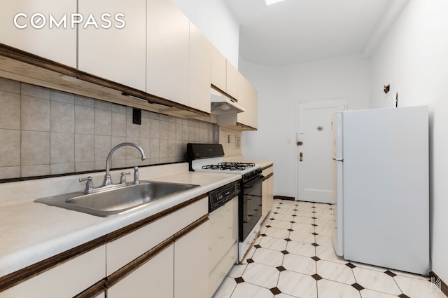 kitchen featuring light countertops, white cabinets, a sink, white appliances, and under cabinet range hood