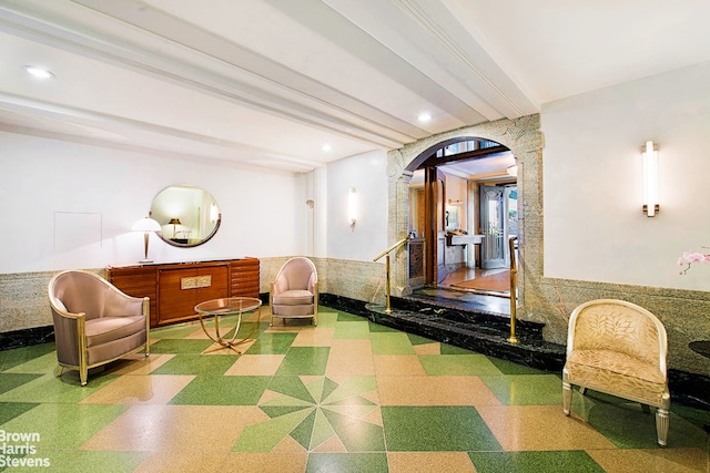 2 Beekman Pl Unit 10B, New York City, NY 10022 - lobby featuring beam ceiling, recessed lighting, and a wainscoted wall