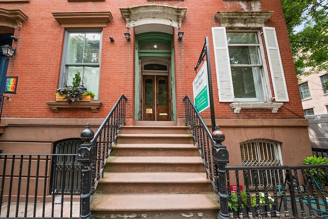 252 W 11th St, New York City, NY 10014 - property entrance featuring brick siding